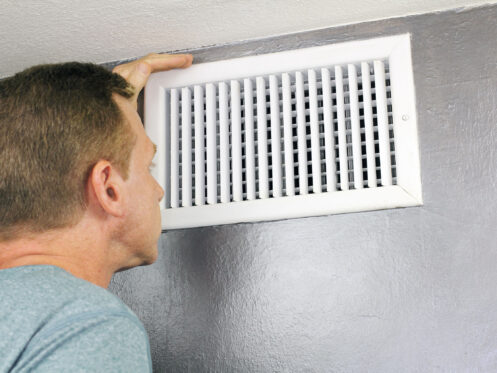 Homeowner looking in vent, no cool air